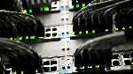 blinking lights on a router switch with cables coming out of the ports.