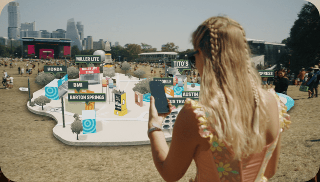 Woman holding smartphone using Snapchat AR-focused features