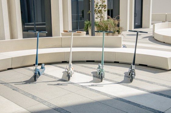 four scooters parked in a row