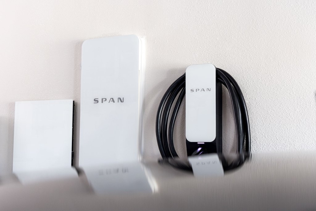 Span electrical panel and EV charger mounted on a wall.