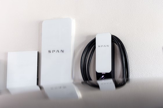 Span electrical panel and EV charger mounted on a wall.