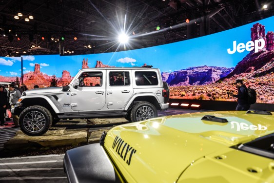 grey and yellow jeeps at the new york international auto show 2023