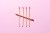 Finished Matchsticks Tally Chart on Pink Background Directly Above View.