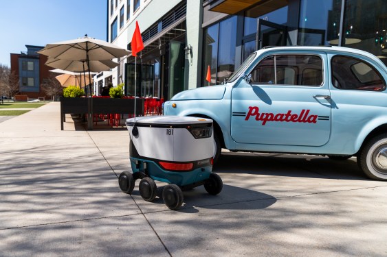 Uber/Cartken delivery bot on sidewalk