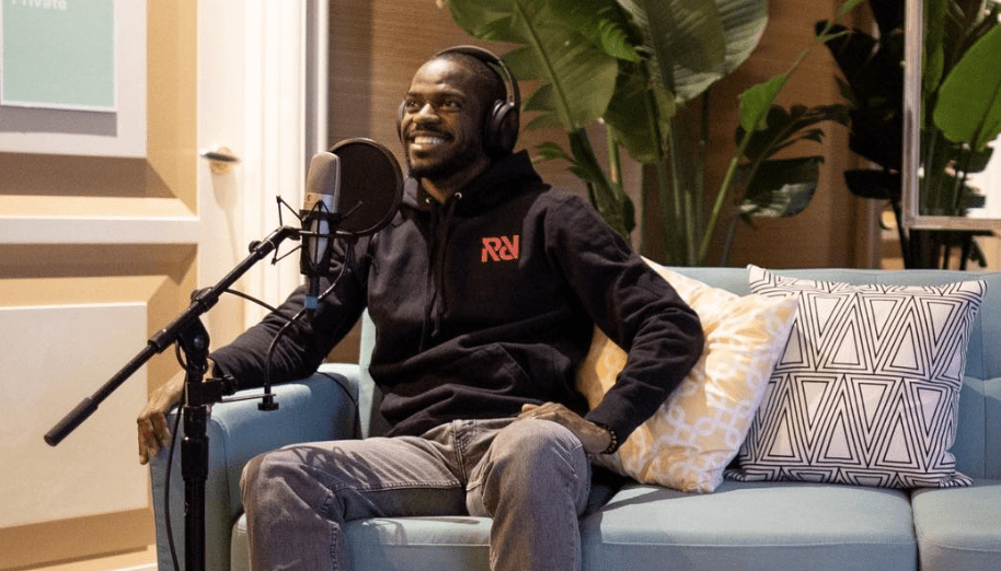 Xaviar Jernigan from Spotify, sitting on a couch in front of a mic