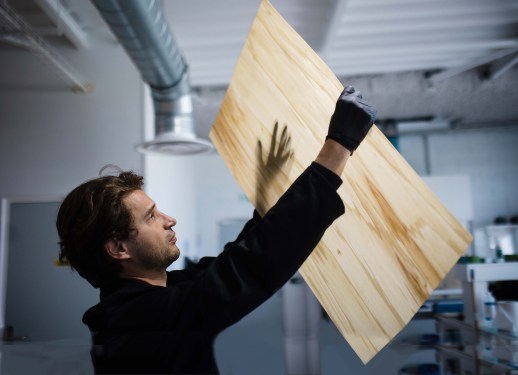 Woodoo founder and CEO Timothée Boitouzet holding a sheet of Woodoo Slim