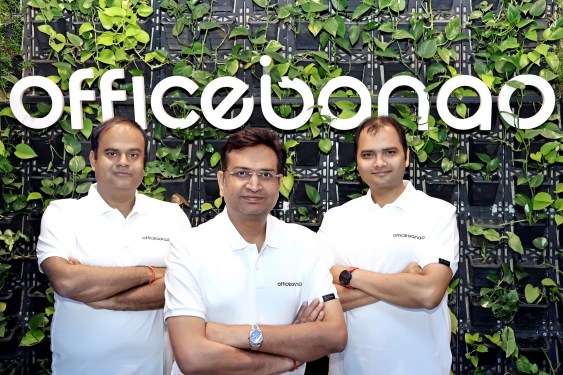 Officebanao founders pose in front of company sign