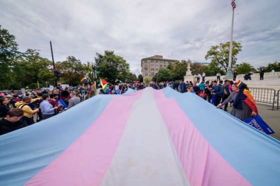 A giant Trans Flag unfurled outside the Supreme Court.