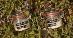 Jars of Farmless alternative proteins laying in green foliage