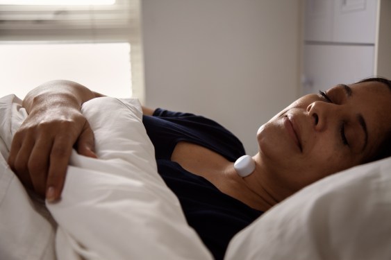 Female patient sleeping AcuPebble device (Photo credit - Acurable)