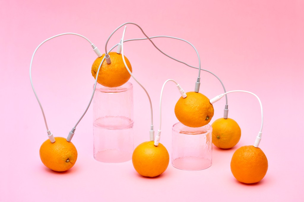 oranges connected by cables to each other