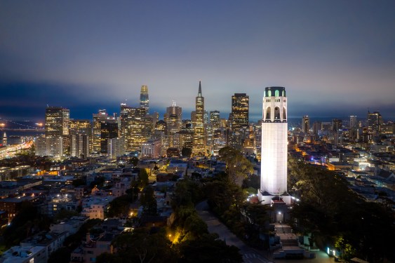 Colorful epic aerial panorama of San Francisco skyline downtown with business building skyscraper and waterfront at twilight in California, USA.