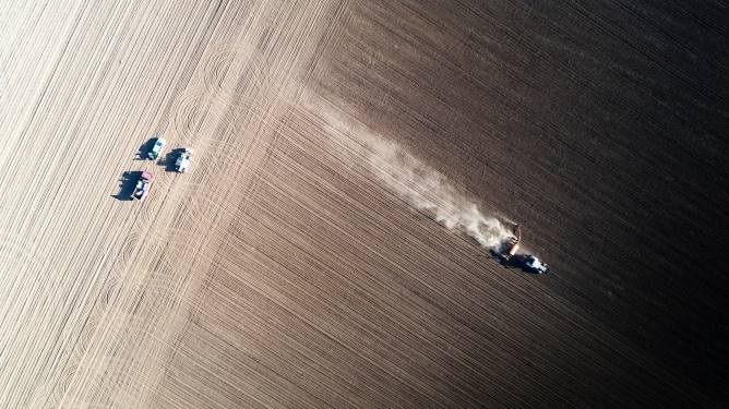 Tractor spreading soil ammendment