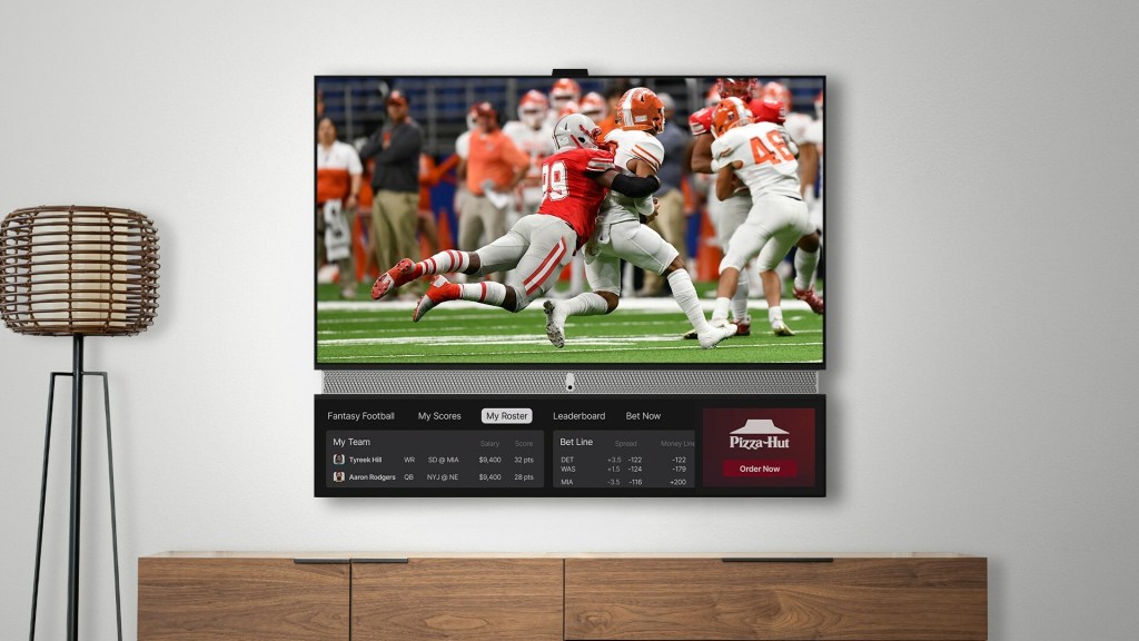 Telly smart tv hanging on a wall