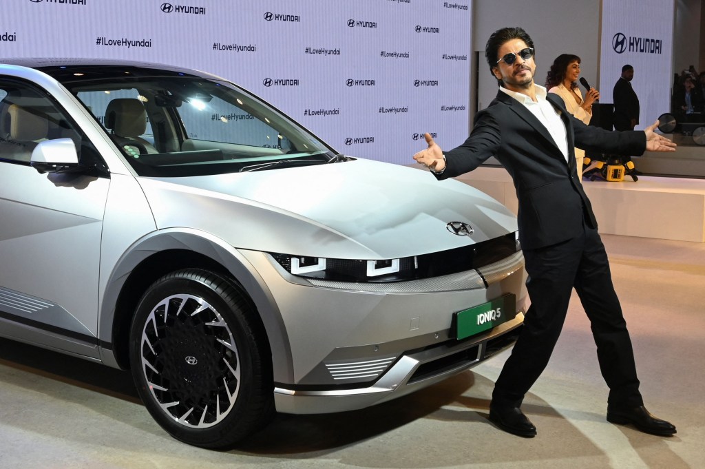 Hyundai Motor India; man standing in front of car