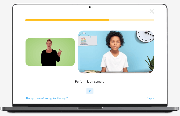 A kid learns sign language on SLAIT's online tutor site.