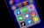 An iphone showing the most popular social apps in a folder.