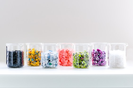 Shredded PET samples in beakers, used in post about DePoly