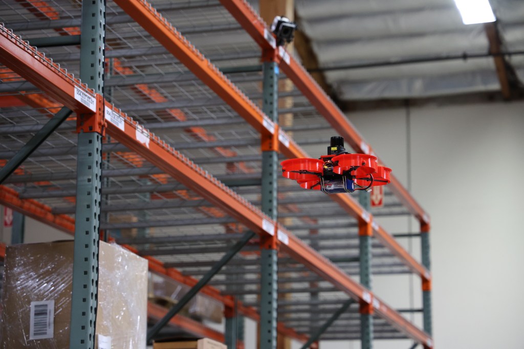 drone flying thru warehouse
