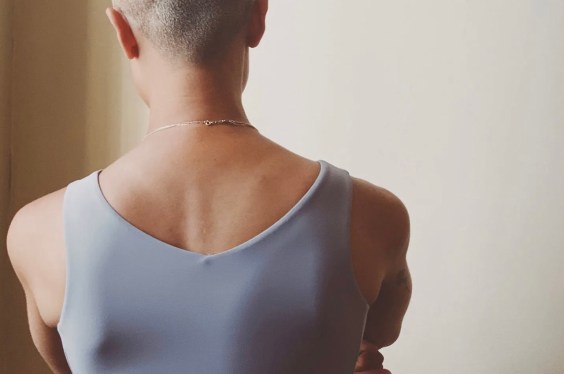 person viewed from behind; neck, shoulders, partial head