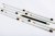 Row of white pencils and one black pencil, lying on a white background