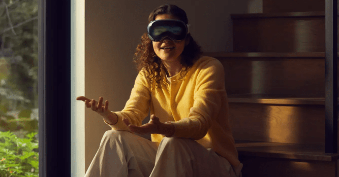 A photo of the Apple Vision Pro worn by a person engaged in conversation