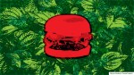 red-tinted hamburger over background of green leaves