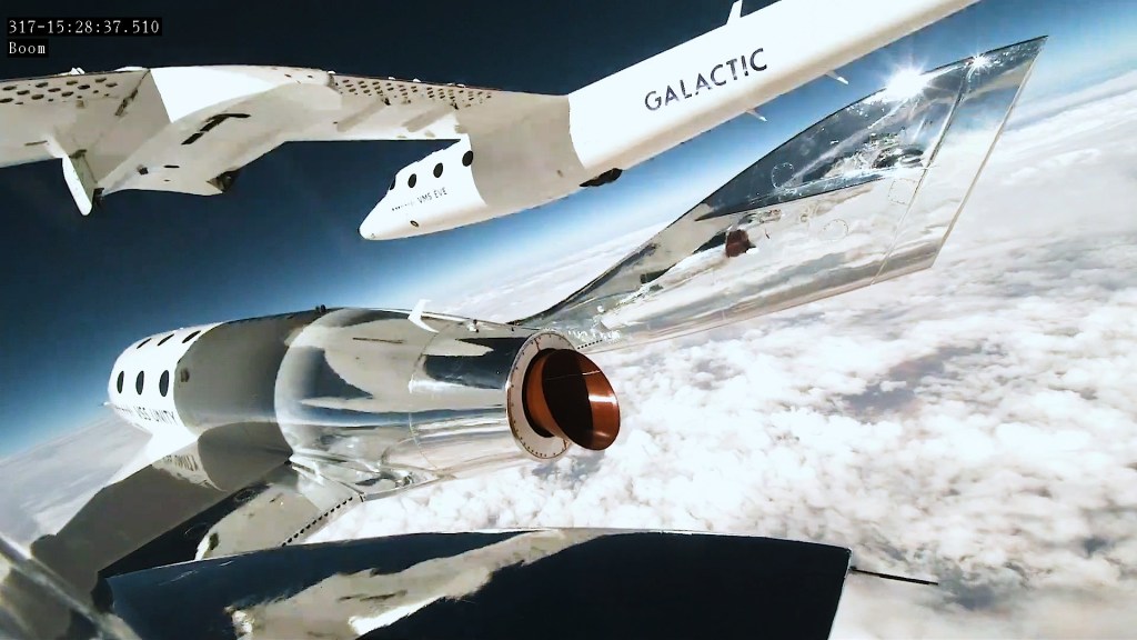 The Virgin Galactic spacecraft separates from its "mothership" at high altitude.v