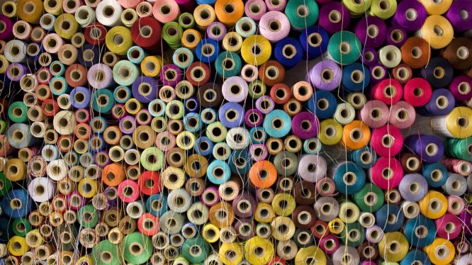 Colorful cotton and silk thread reels.