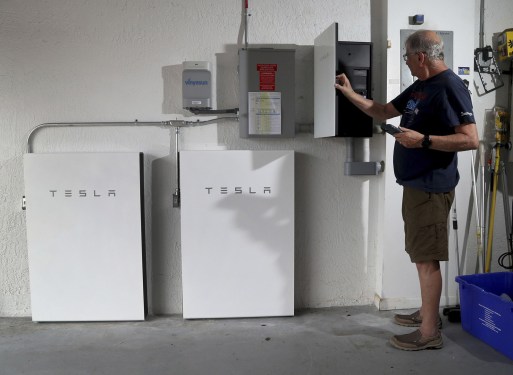 Two Tesla Powerwalls installed at a residential home.