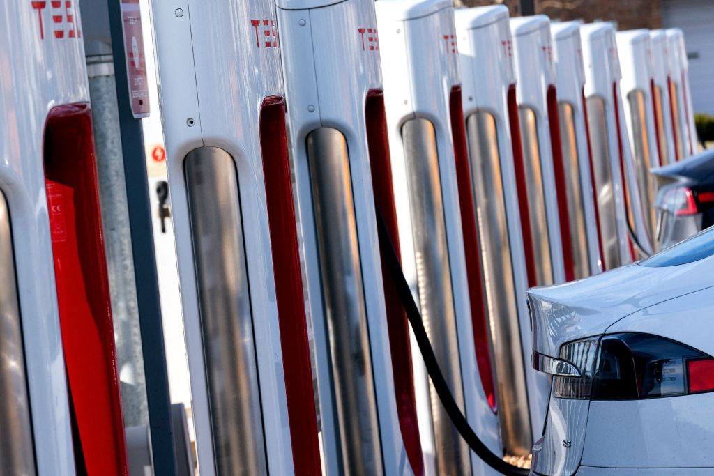 Cars charge up at a Tesla charging station