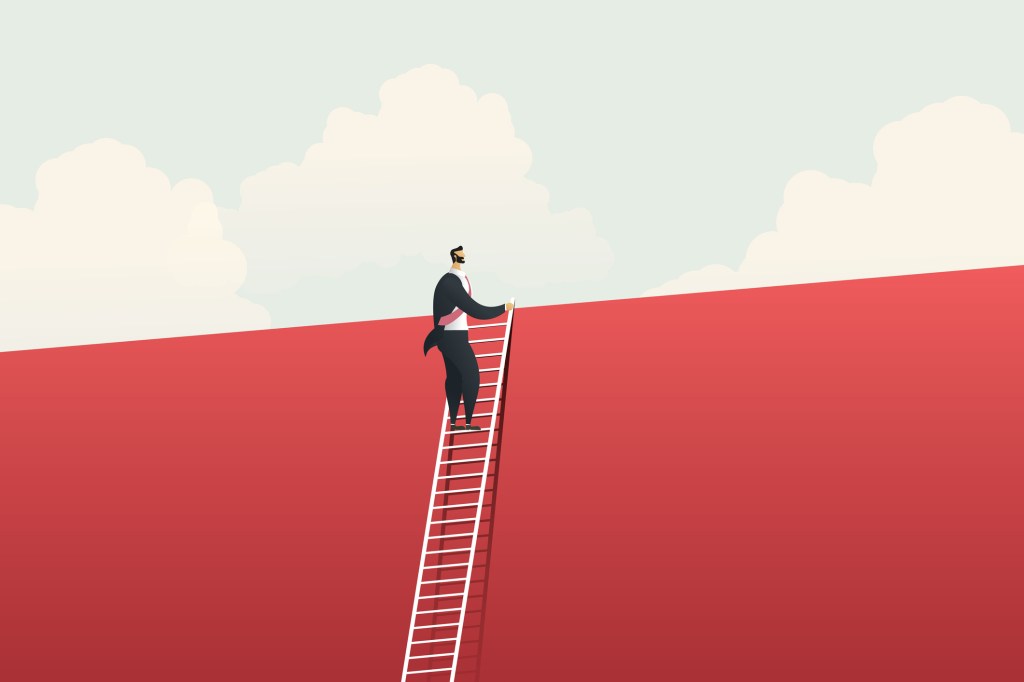 Business man slowly climbing a ladder and able to see over the top of the wall it's leaning against.
