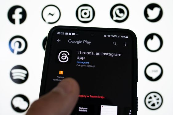 Image of Threads, an Instagram app in the app store with twitter, whatsapp, instagram and facebook logos in the background