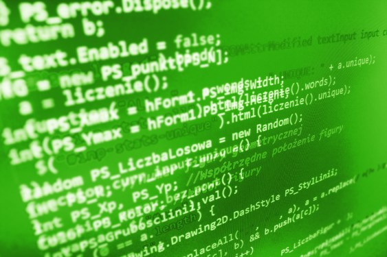 Software code on green screen fading at the edges.
