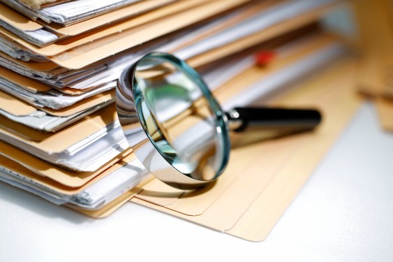 Magnifying glass Search Documents ; shot with very shallow depth of field, used in post about Fileread