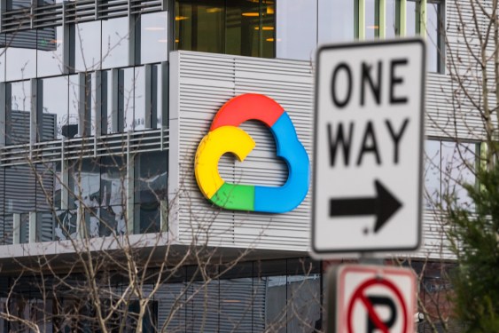 Google Cloud logo on the side of.a building with a one way sign in the foreground.