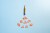 Worn orange pencil on a blue colored background with shavings arranged as if it's a rocket taking off