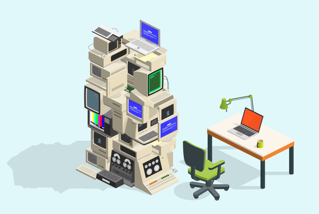 Pile of cold equipment next to a modern laptop on a desk.