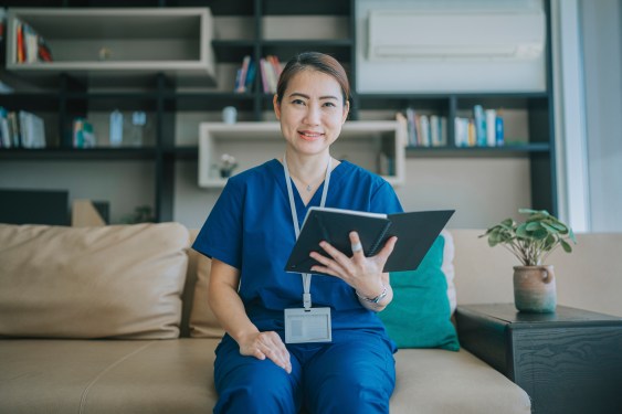 Female doctor with tablet getting ready for a telehealth conference, used in a post about HealthXCapital and Jungle Ventures