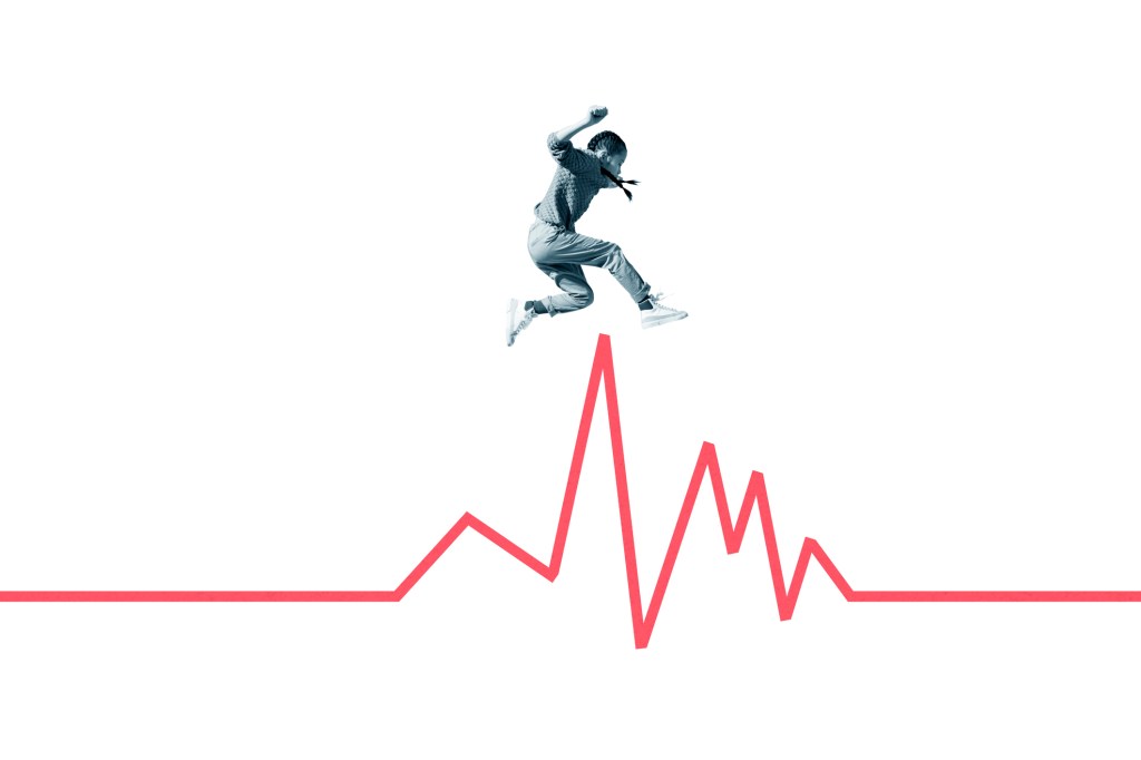 Side view of girl jumping over red line graph against white background