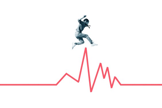 Side view of girl jumping over red line graph against white background