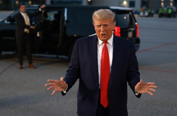 ATLANTA, GEORGIA - AUGUST 24: U.S. President Donald Trump speaks to the media at Atlanta Hartsfield-Jackson International Airport after being booked at the Fulton County jail on August 24, 2023 in Atlanta, Georgia. Trump was booked on multiple charges related to an alleged plan to overturn the results of the 2020 presidential election in Georgia.