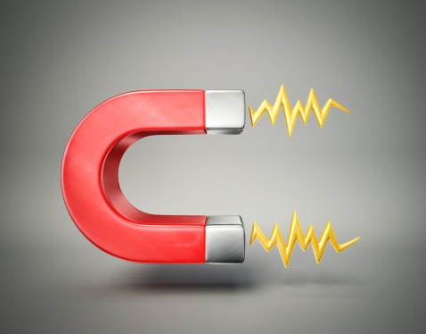 red magnet isolated on a grey background
