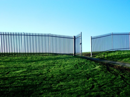 an open gate in a fenced area
