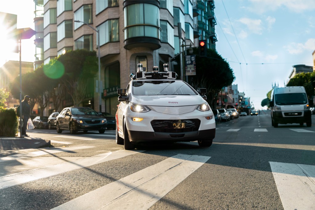 Cruise driverless taxi turning right over crosswalk