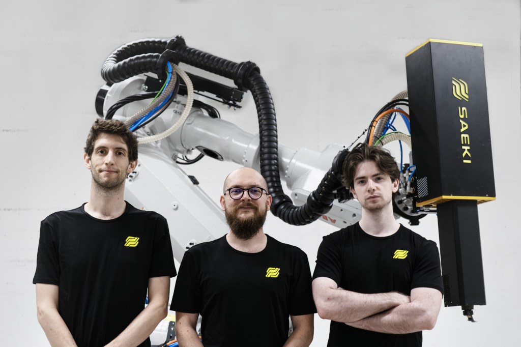 SAEKI founders Oliver Harley, Matthias Leschok and Andrea Perissinotto pictured with one of their robotic microfactories