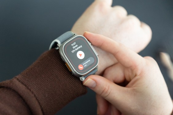 Apple Watch Ultra 2 on a wrist, with the Siren app open and the wearer's finger on the Digital Crown