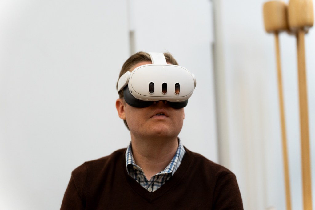 Man wearing the Meta Quest 3 mixed reality headset, viewed from the front