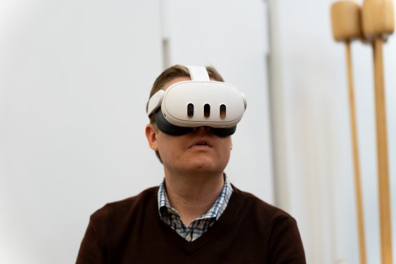 Man wearing the Meta Quest 3 mixed reality headset, viewed from the front