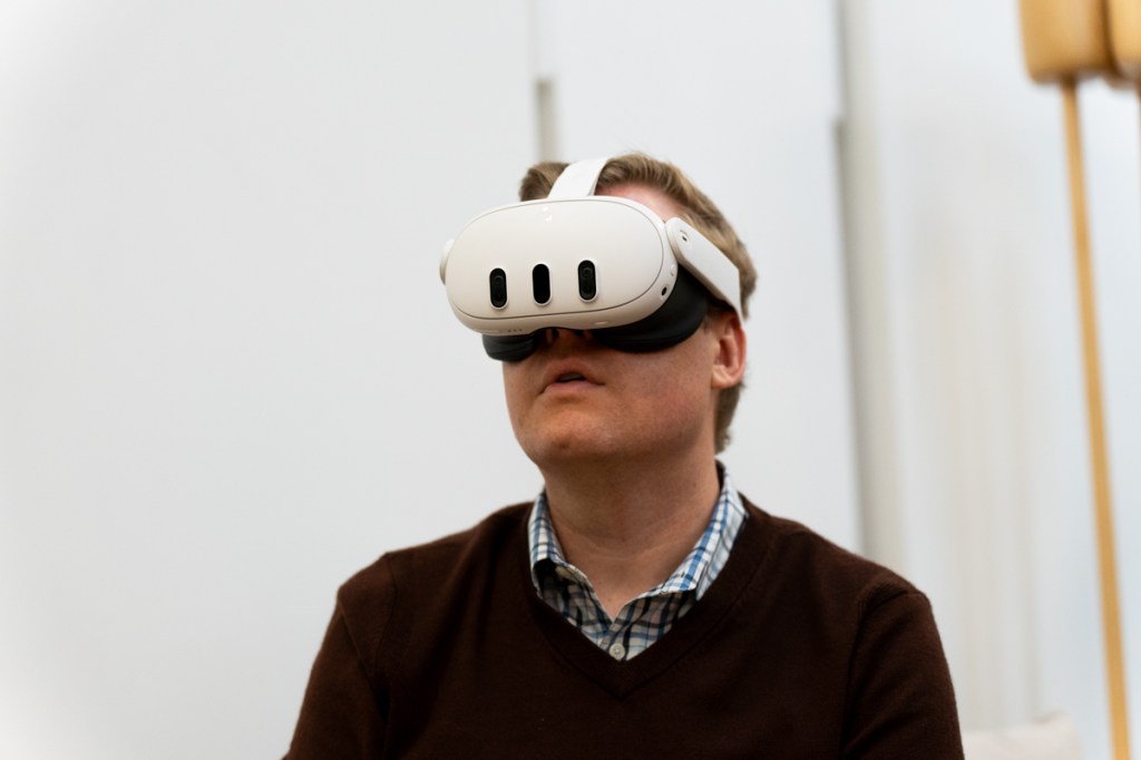 Man wearing the Meta Quest 3 mixed reality headset, viewed from the front